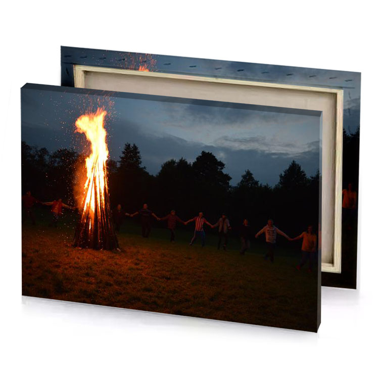 a group of people standing around fire maroon canvas