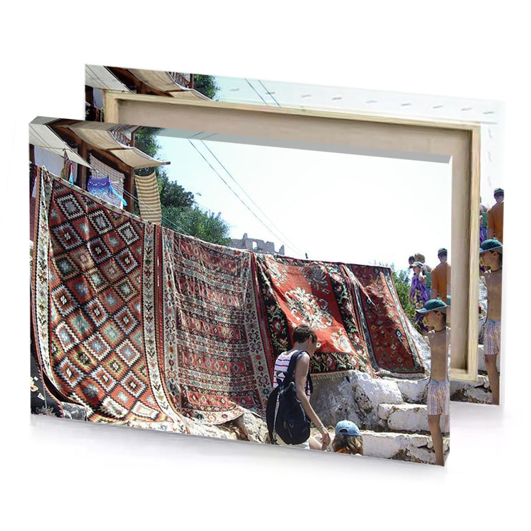 a group of people standing around pile rugs garnet canvas