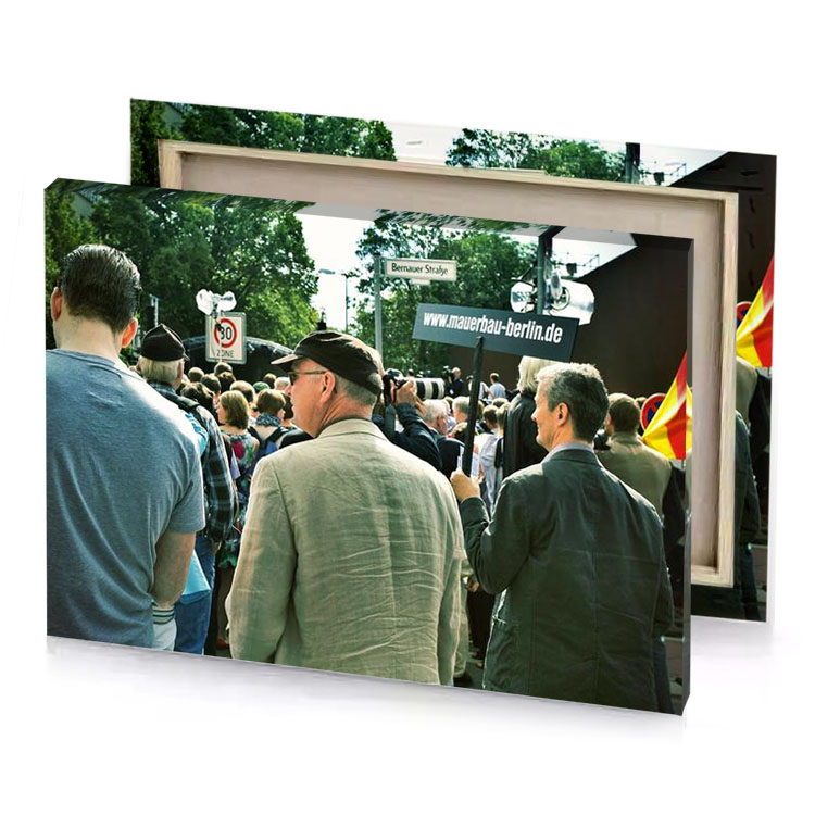 a group of people standing in crowd camouflage green canvas