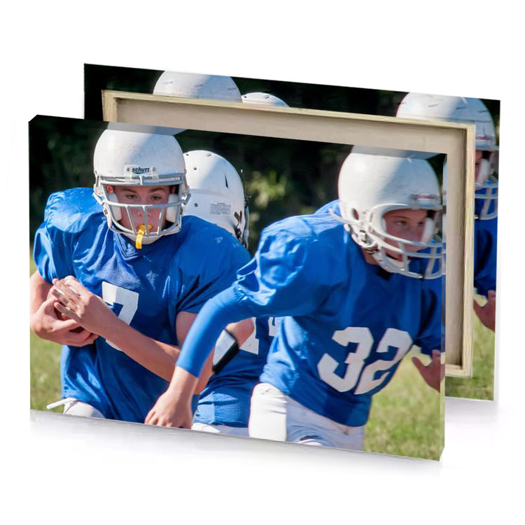 a group of young boys playing football on field cobalt blue canvas