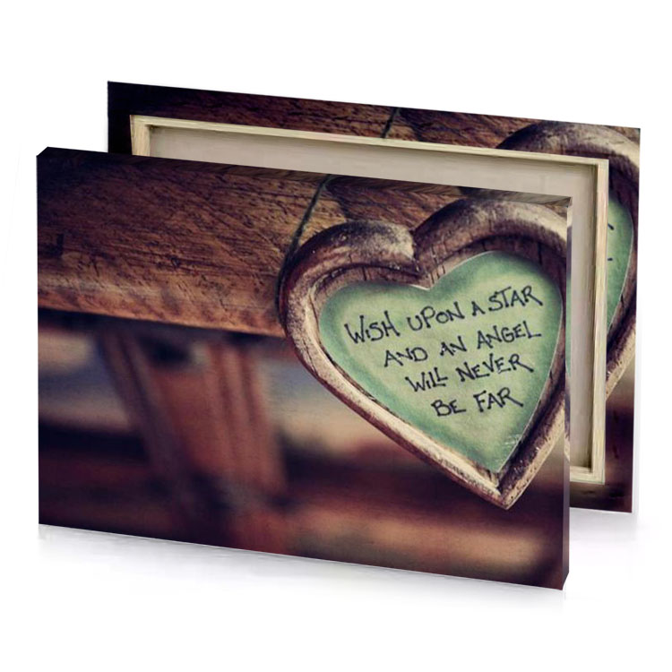 a heart hanging from wooden bench with message written on garnet canvas