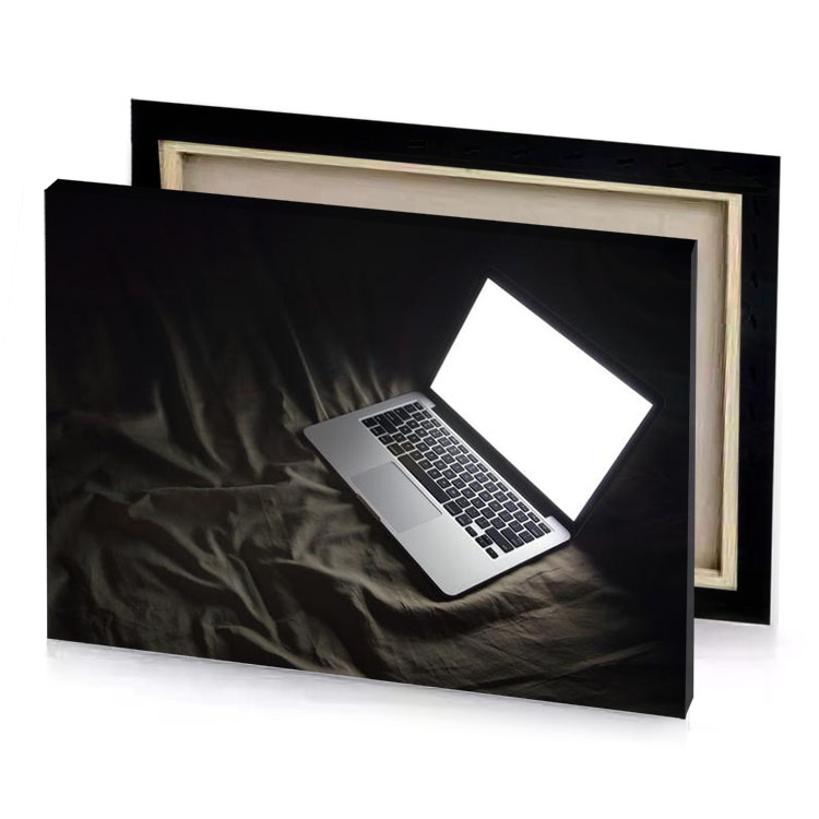 a laptop computer sitting on bed charcoal canvas