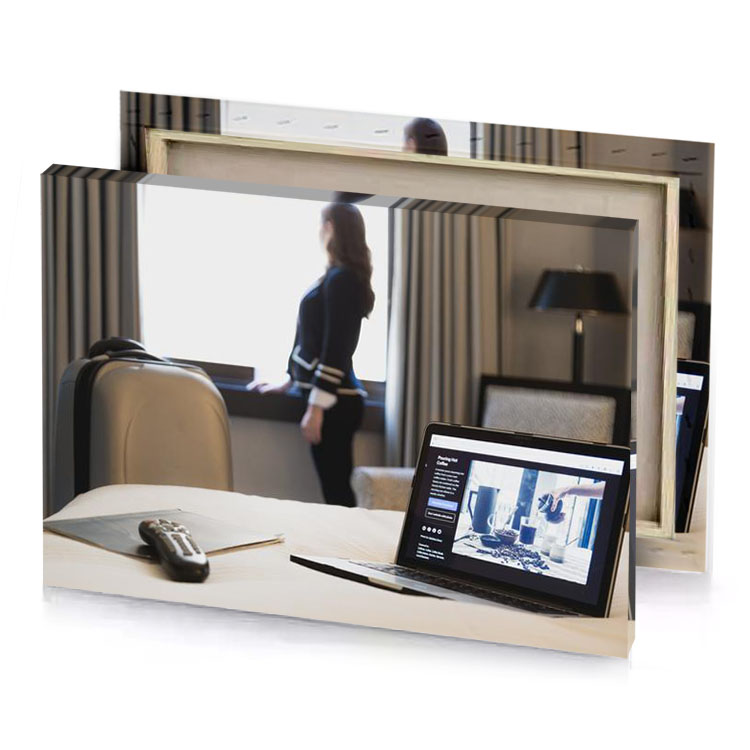 a laptop computer sitting on bed next to woman platinum canvas