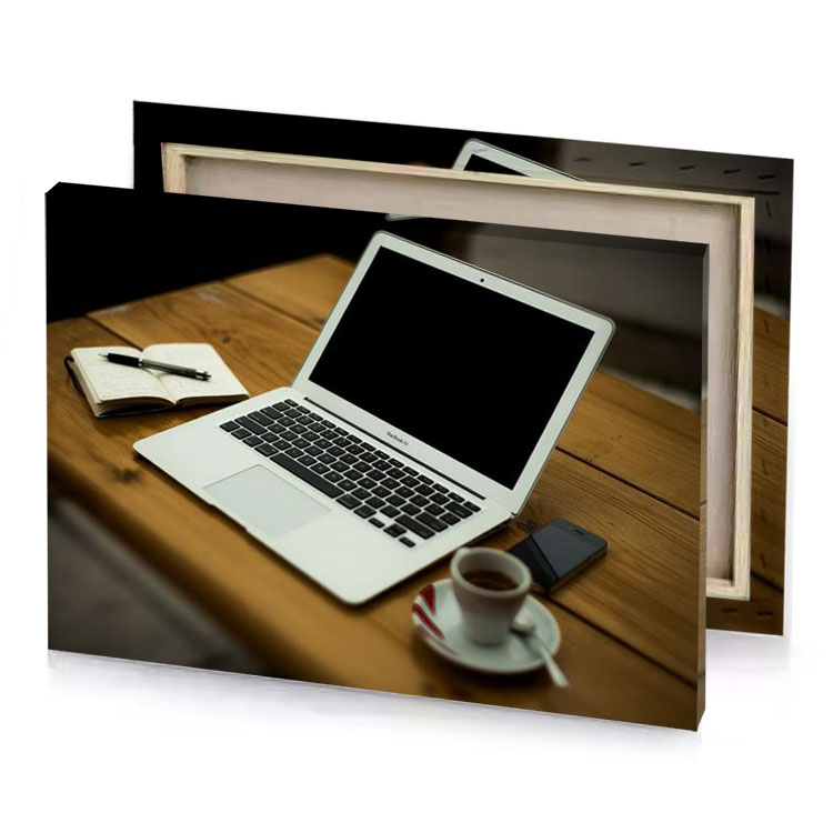 a laptop computer sitting on wooden table gainsboro canvas