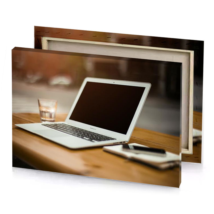 a laptop computer sitting on wooden table smoky black canvas