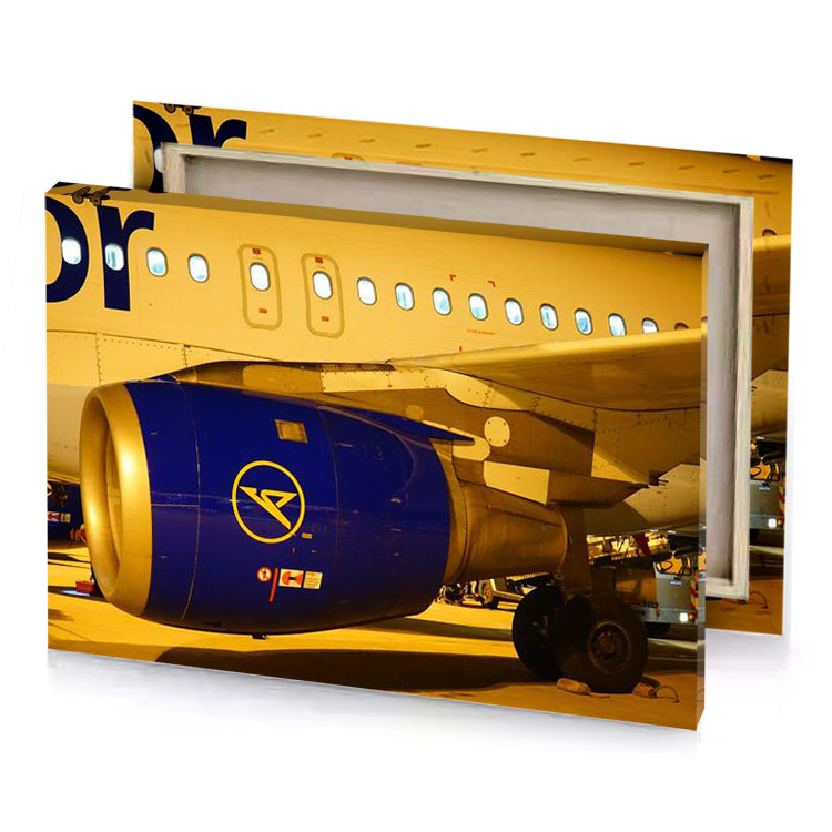 a large airplane sitting on runway at night prussian blue canvas