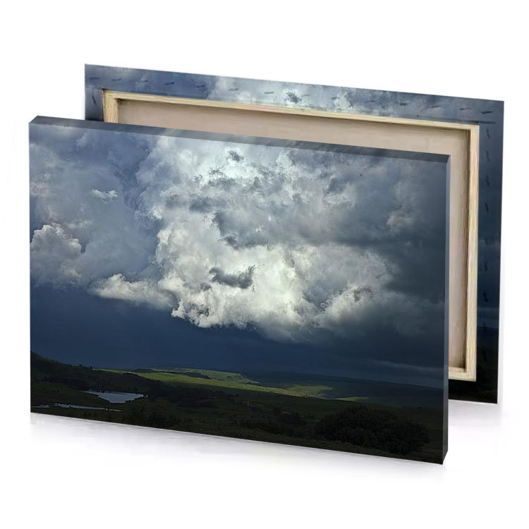 a large cloud over lake in the middle of field silver canvas