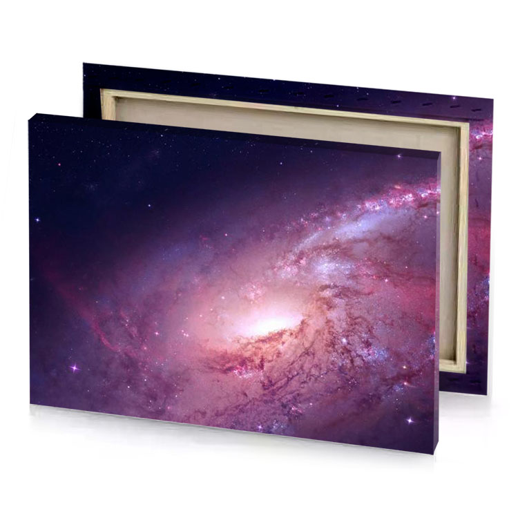a large galaxy with bright pink center and dark blue rosy brown canvas