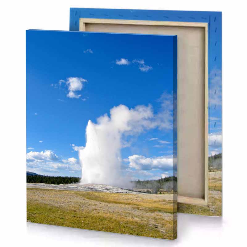 a large geyser in the middle of field denim blue canvas