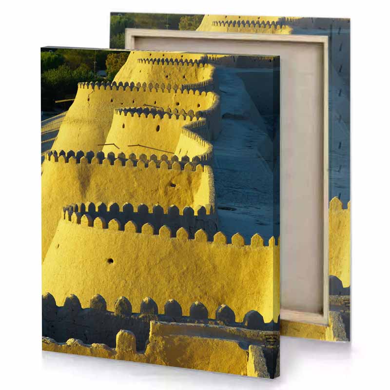 a large sand castle with clock on top copper canvas