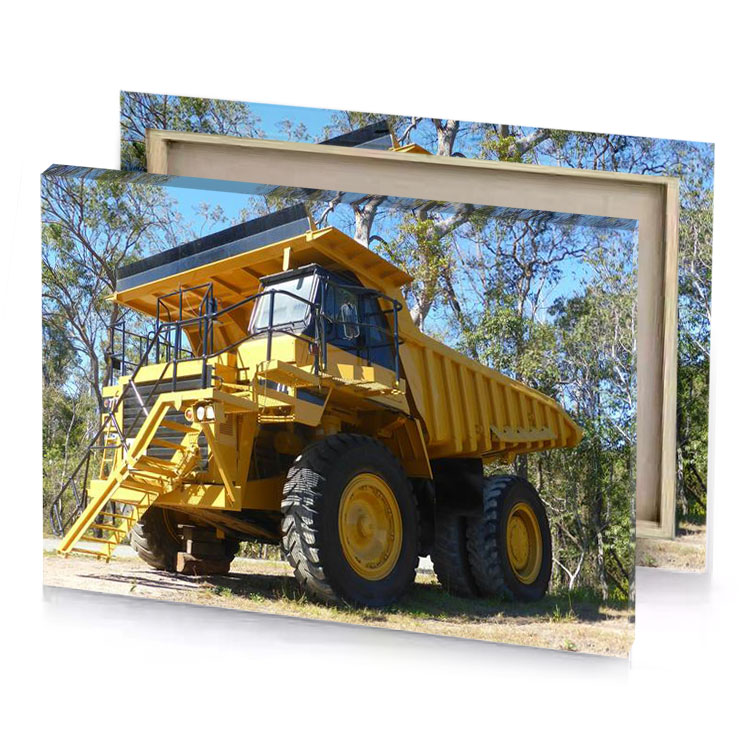 a large yellow dump truck parked in field sepia canvas