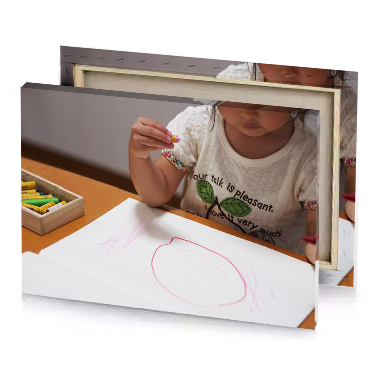 a little girl is drawing picture on piece of paper platinum canvas