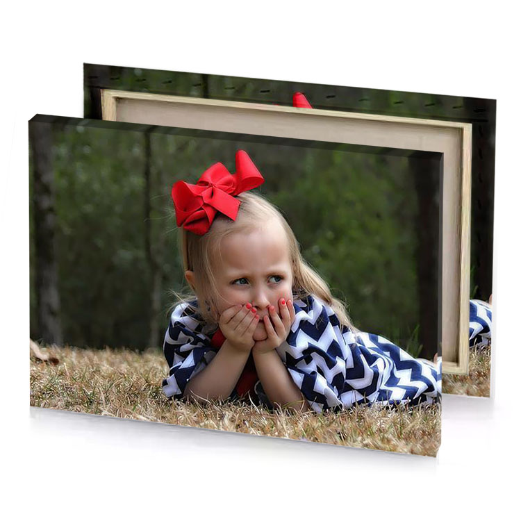 a little girl laying on the ground bistre canvas
