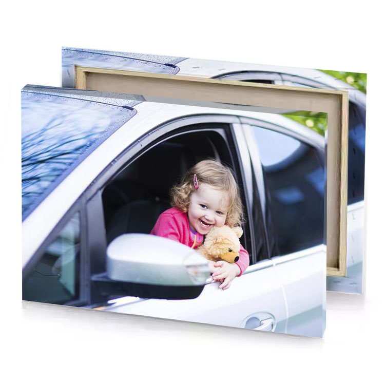 a little girl sitting in car holding teddy charcoal canvas