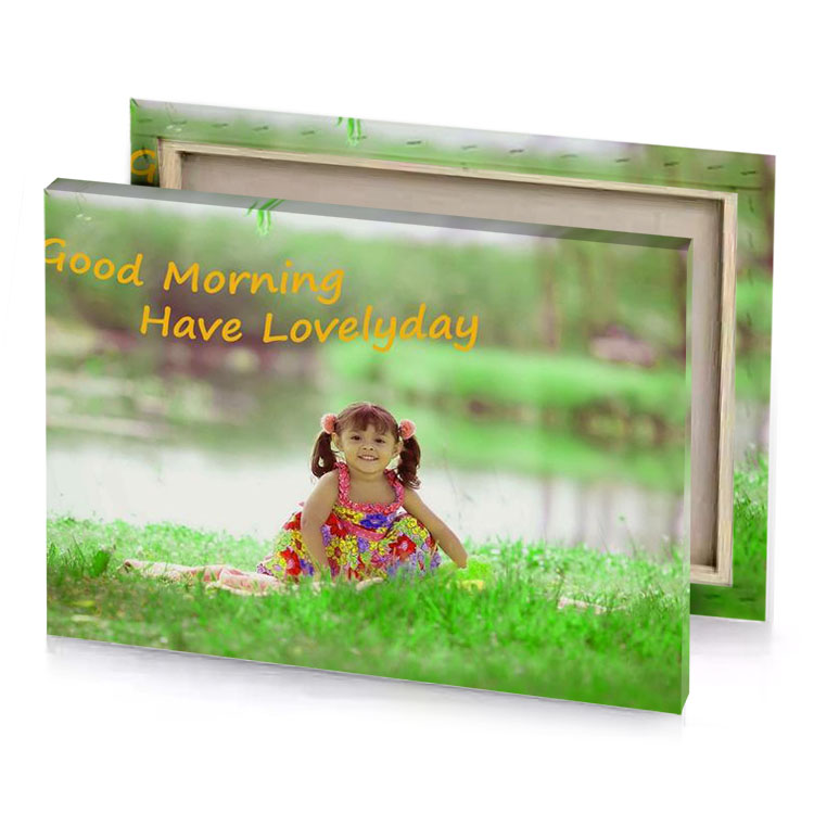 a little girl sitting in the grass with words god light green canvas