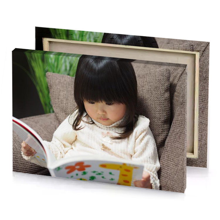 a little girl sitting on couch reading book rosy brown canvas