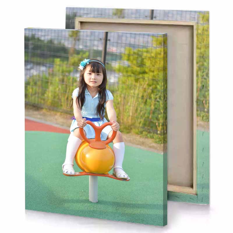 a little girl sitting on toy playground dark sea green canvas