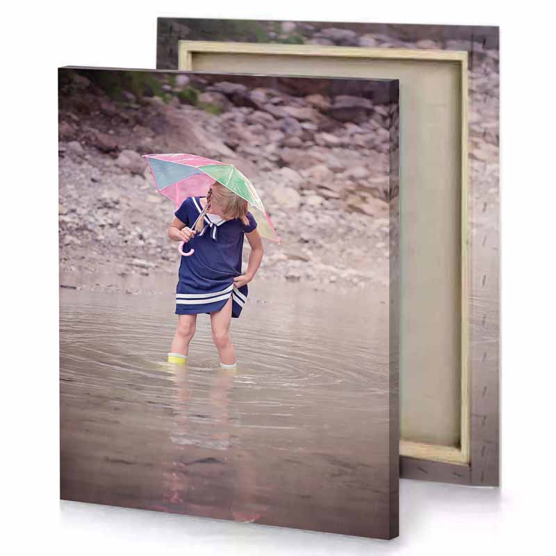 a little girl standing in river holding an umbrella silver canvas