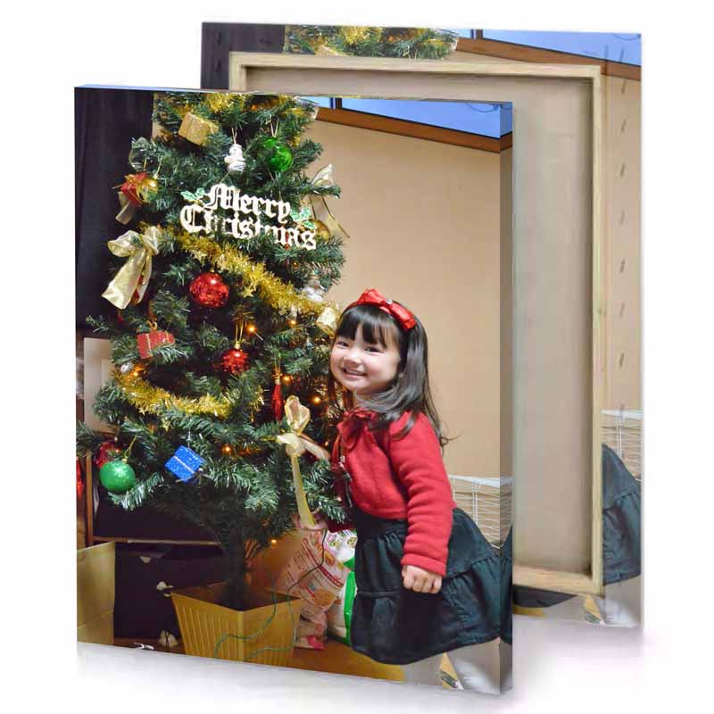 a little girl standing next to christmas tree tan canvas