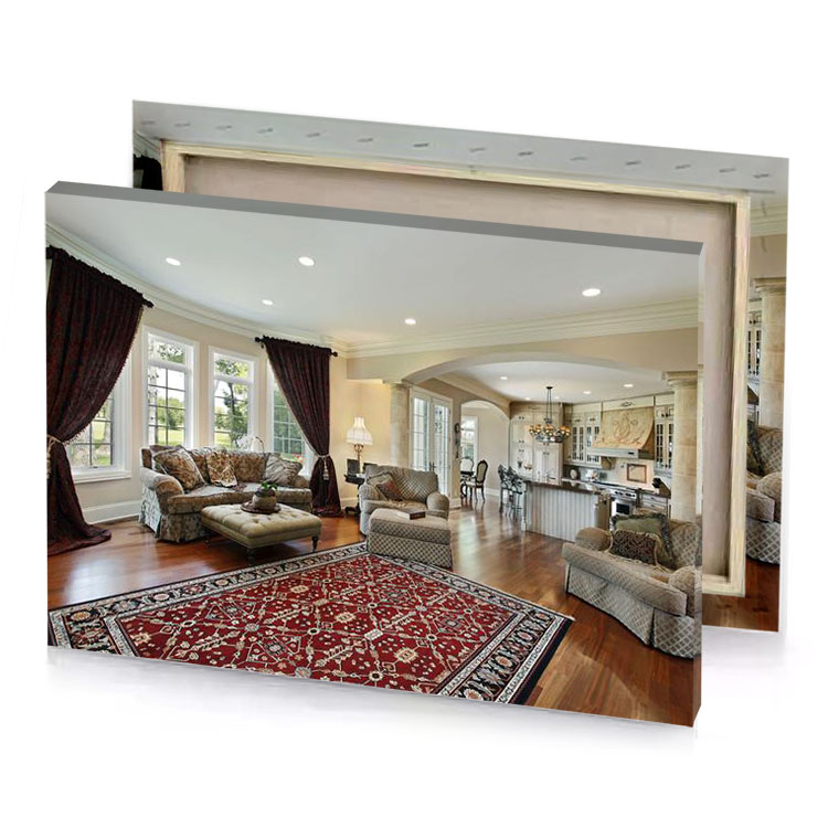 a living room with red rug and couch tan canvas