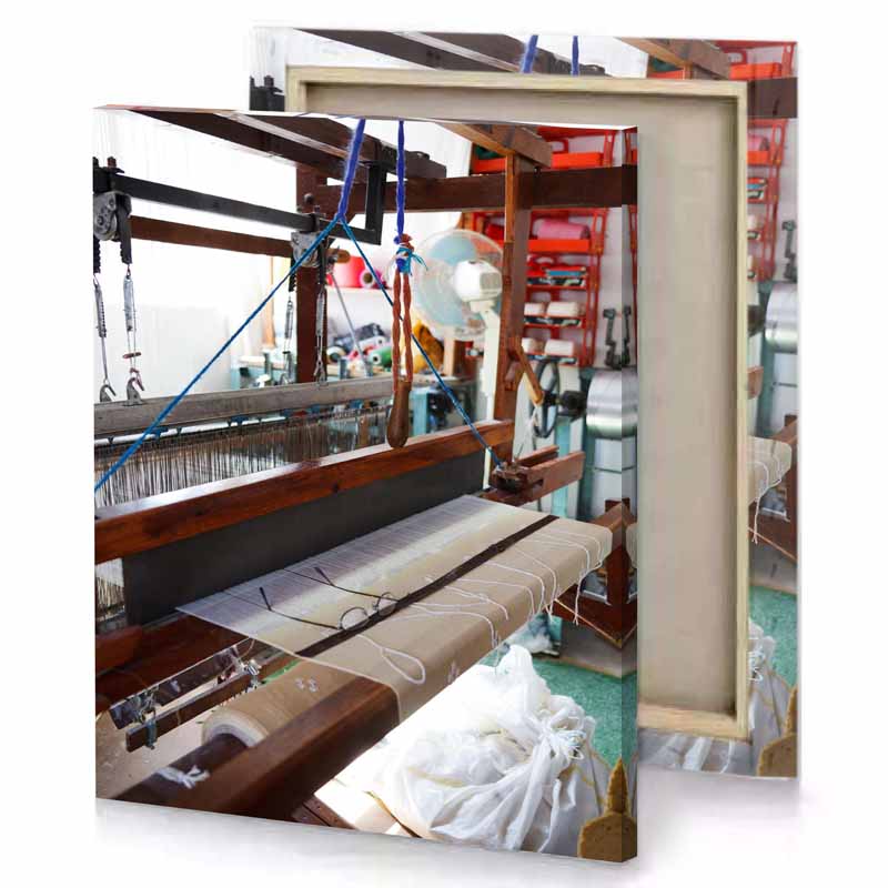 a machine is working on piece of fabric bistre canvas