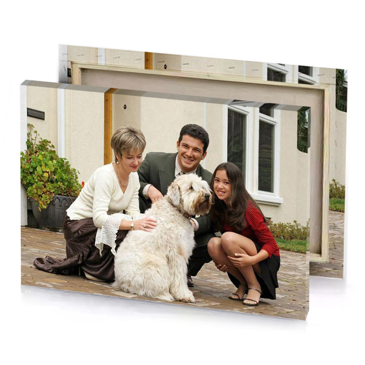 a man and two women sitting on brick patio with silver canvas