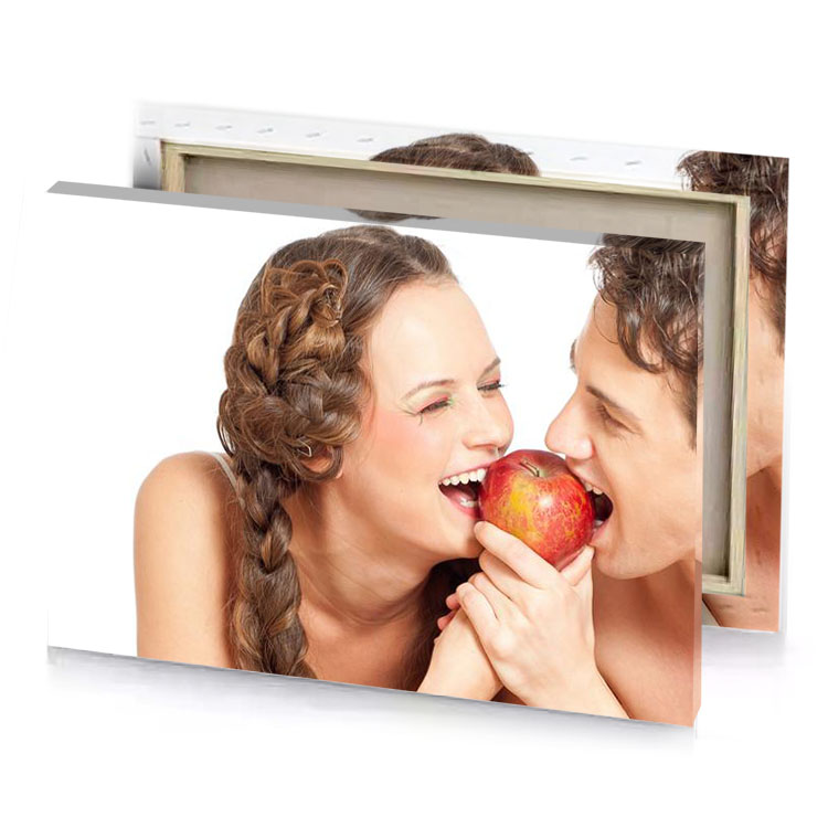 a man and woman are eating an apple white canvas