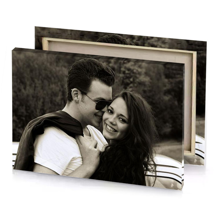 a man and woman are hugging in front of car smoky black canvas