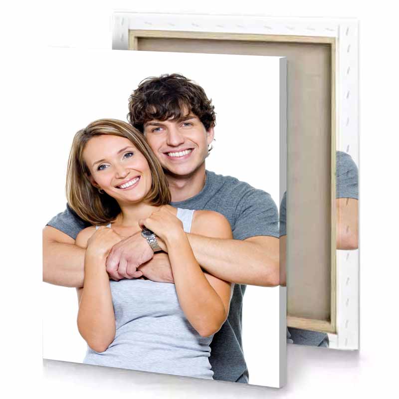 a man and woman are hugging white canvas