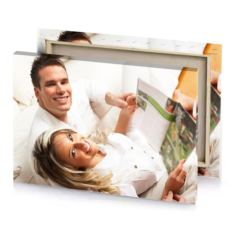 a man and woman are laying on bed linen canvas