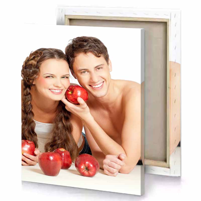a man and woman are posing with apples snow canvas