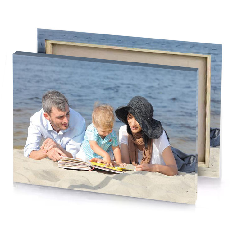 a man and woman child are sitting on the sand manatee canvas