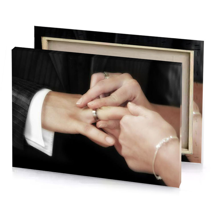 a man and woman holding hands while they hold their tan canvas