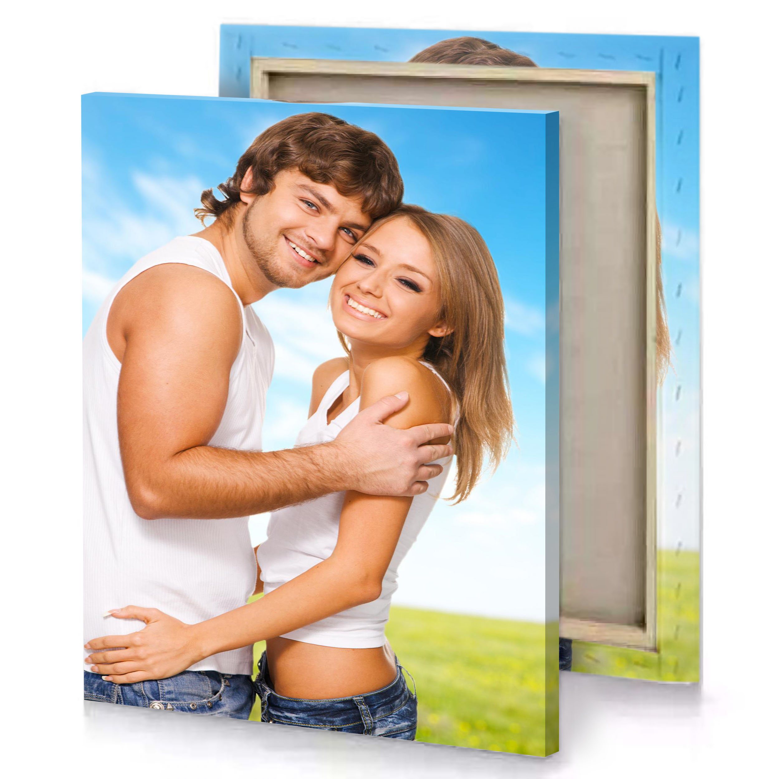 a man and woman hugging in field blue jeans canvas