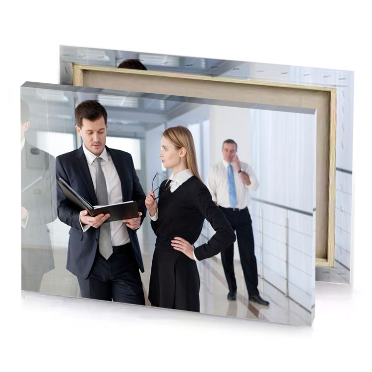 a man and woman in business attire standing hallway platinum canvas