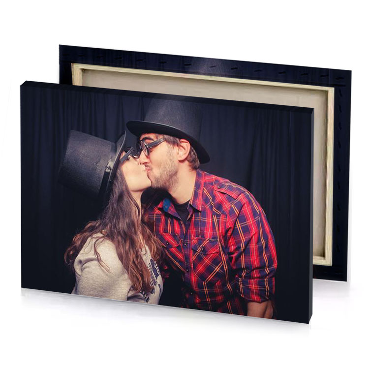 a man and woman kissing in front of black curtain smoky canvas
