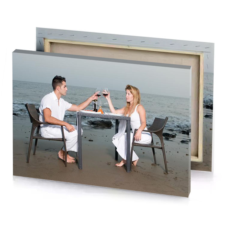 a man and woman sitting at table on the beach white smoke canvas