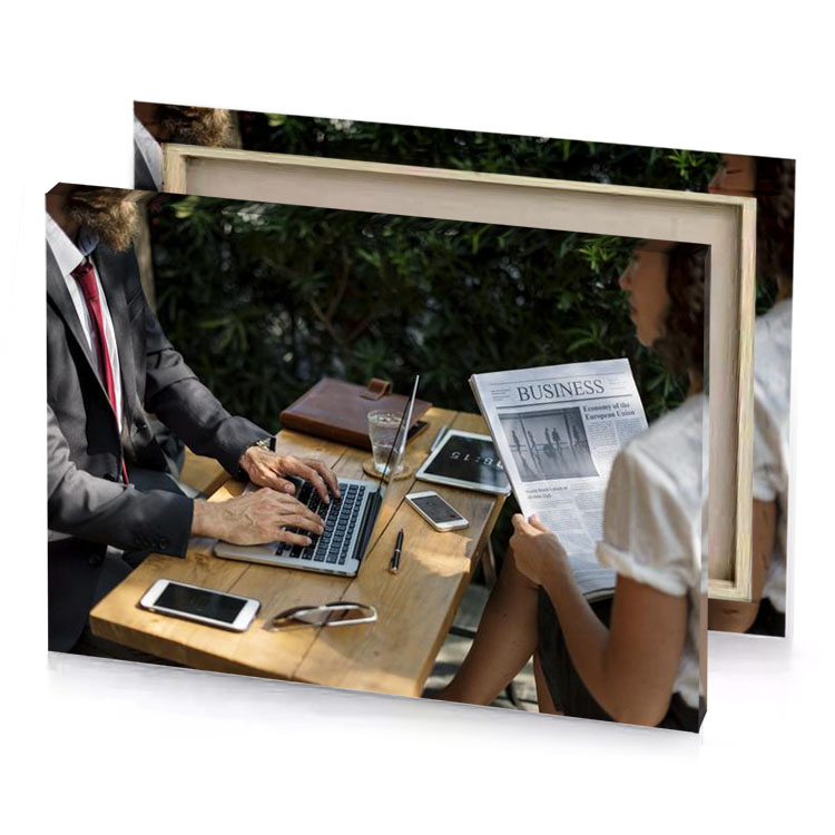 a man and woman sitting at table with laptop camouflage green canvas