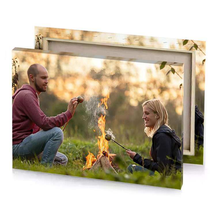 a man and woman sitting by fire dark olive green canvas