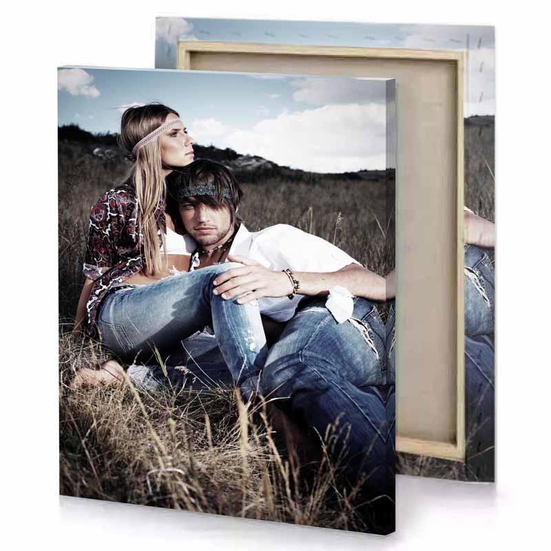 a man and woman sitting in field smoky black canvas