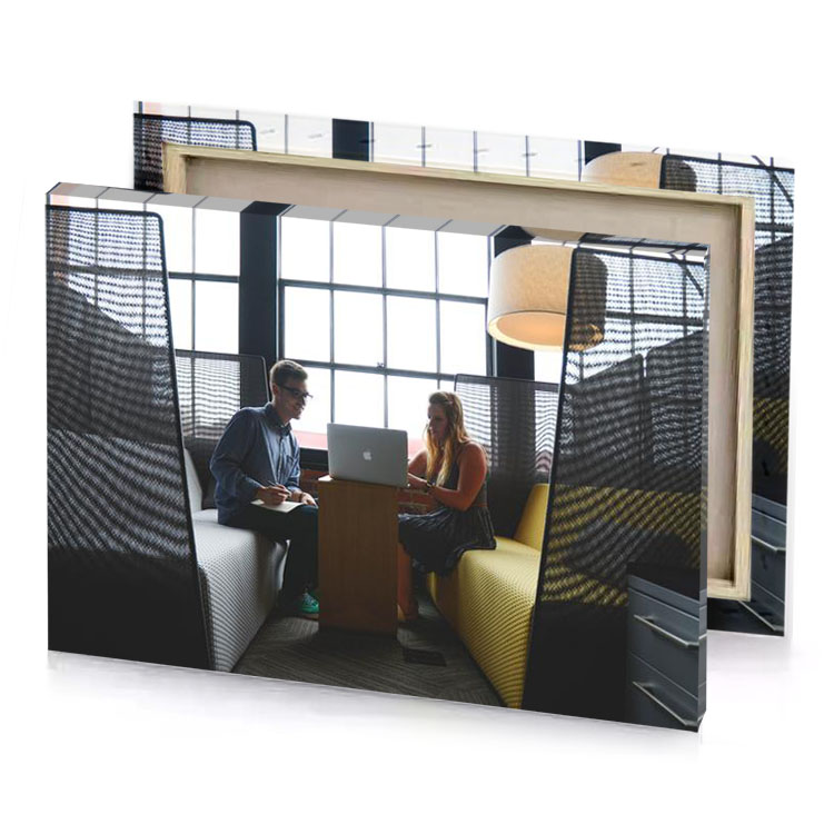 a man and woman sitting in room with laptop ghost white canvas