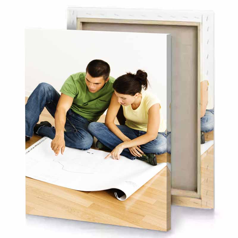 a man and woman sitting on the floor dark olive green canvas