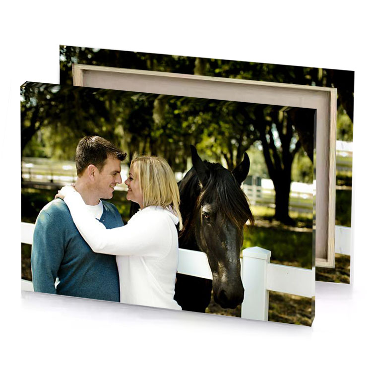 a man and woman standing next to horse smoky black canvas