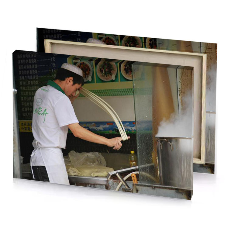 a man cooking food in kitchen with large pot rosy brown canvas