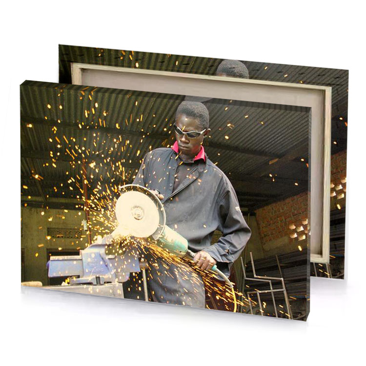 a man cutting piece of metal with circular saw bistre canvas