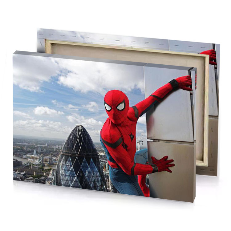 a man dressed as spiderman on skyscraper brown canvas