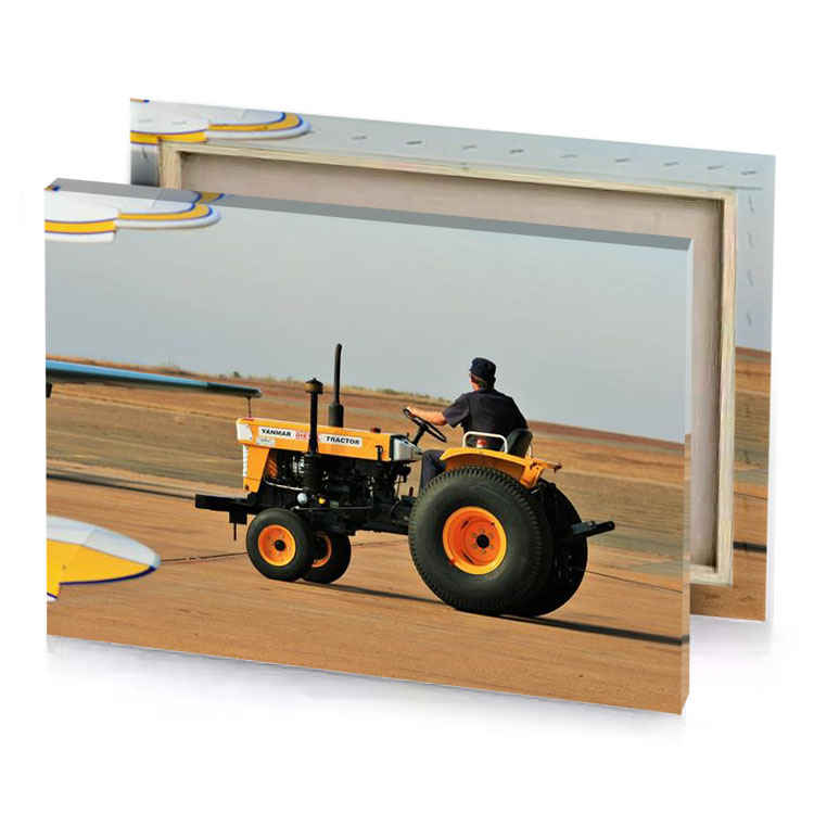 a man driving tractor on dirt road silver canvas