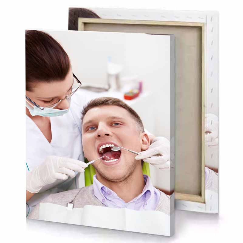 a man getting his teeth checked by dentist platinum canvas