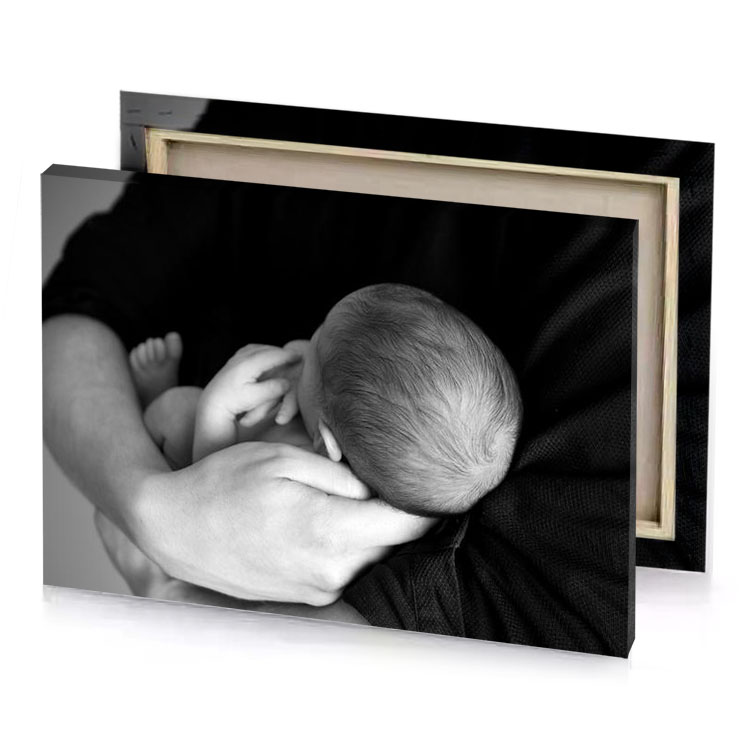 a man holding baby in his arms platinum canvas