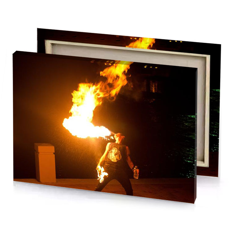 a man holding fire stick on sidewalk carrot orange canvas
